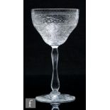 An early 20th Century Webb Corbett rock crystal style drinking glass, circa 1930, the ogee bowl