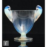 A Rene Lalique Ornis vase, model 976, circa 1926, of footed ovoid form with twin handles modelled as