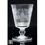 An early 19th Century glass rummer, circa 1810, finely engraved with a monogram within a vine with a