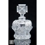 A 19th Century clear cut crystal scent bottle in the form of a crown, the open work body with cut