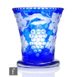 A 1930s Stevens & Williams glass vase of footed flared form cased in blue over clear crystal and cut