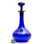 A 19th Century French glass decanter, circa 1860, of squat globe and shaft form, the cobalt blue
