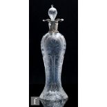 An early 20th Century Stevens & Williams grotesque type decanter of shouldered form, decorated