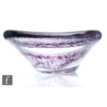 A 1950s Kosta glass bowl designed by Vicke Lindstrand, of flared circular form with a wave rim,