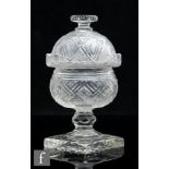 A 19th Century clear crystal glass sweetmeat jar and cover, the domed cover with flat finial above
