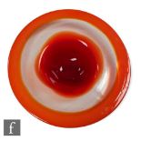 A large art glass dish, of shallow circular form with wide flat rim, decorated with graduating