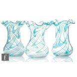 A trio of late 19th Century Thomas Webb & Sons Filamentosa glass vases with everted frill rims,
