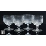A set of four late 19th Century wine glasses, the ovoid bowl cut with a strawberry diamond band