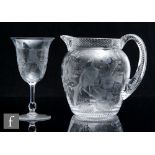 An early 20th Century Stevens & Williams clear crystal water jug of swollen ovoid form with