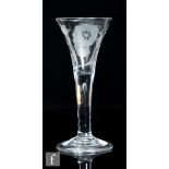 An 18th Century Jacobite two piece drinking glass, circa 1750, the drawn trumpet bowl engraved