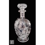 A late 19th Century Stourbridge clear crystal vase of footed ovoid form with collar neck and triform