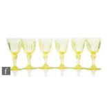 A set of six 19th Century Uranium wine glasses, each with a round funnel bowl with basal slice cut