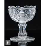 A 19th Century clear crystal glass pedestal sugar bowl, the ovoid bowl with a scalloped rim and