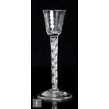 An 18th Century gin glass, circa 1745, the round funnel bowl with planished finish above a double