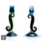 A pair of 1930s Gray-Stan glass candlesticks, the upper sconce supported by an S form scroll above a