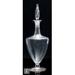 An early 20th Century John Walsh Walsh glass decanter, circa 1910, of footed form, optic moulded