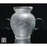 A hallmarked silver and glass vase, the ribbed and diamond cut body with applied twin green glass