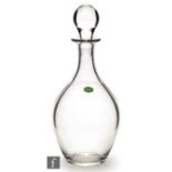 An early 20th Century Stuart Crystal glass decanter, of plain ovoid form with tapering stopper,