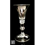 An 18th Century wine goblet circa 1740, the bell bowl above a teared knop before a merese collar,