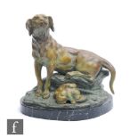 A 20th Century French spelter study of a pointer with two pups feeding, after R. Jarnier, on oval