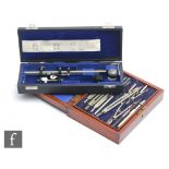 An Air Ministry mahogany cased set of drawing instruments inset with a brass plaque dated 1939,