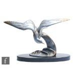 A 20th Century part gilt silvered metal study of a gull on top of a breaking wave, after Irenee
