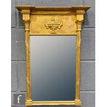 A 19th Century gilt rectangular wall mirror, the frieze mounted with an urn embellishment flanked by