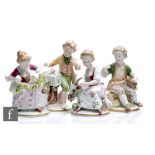 A set of four later 20th Century Unterweissbach figurines modelled as four seated children with