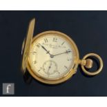 An 18ct half hunter, crown wind pocket watch, Arabic numerals to a white enamelled dial, case