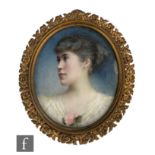 ENGLISH SCHOOL (CIRCA 1900) - Portrait of a young lady, bust length, watercolour miniature on