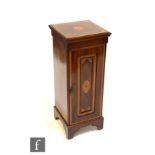 An Edwardian inlaid and satinwood cross-banded mahogany floor standing coin cabinet, the interior