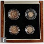 George V - 1933 four coin set of Maundy coins with certificate, in teak case.