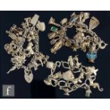 Three silver curb link charm bracelets, each with various charms attached, total weight 238g. (3)