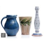 Three pieces of later 20th Century studio pottery comprising a candlestick, jug and flower pot