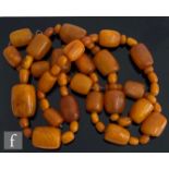 A 19th Century single row of butterscotch amber beads twenty three cushioned rectangular examples