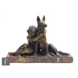 A 20th Century bronze spelter figure of a child with an Alsatian, after Godard, on veined marble