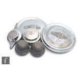 A pair of chrome Sunbeam hub caps, two Sunbeam filler caps, and two brass hub caps stamped Carvan,