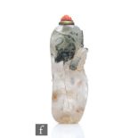 A 19th Century Chinese dendritic chalcedony 'Eggplant' snuff bottle, the transparent stone with dark