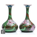 A pair of early 20th Century Foley (Wileman & Co) Art Nouveau Intarsio bottle vases each decorated