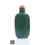 A 19th Century Chinese porcelain snuff bottle of rounded rectangular form, the dark spinach green