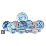 A collection of 18th Century Chinese porcelain teabowls and saucers, all matched, to include various