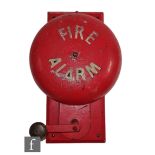A 1940s or later red painted hand crank operated Fire Alarm mounted on a wooden board, height 46cm.