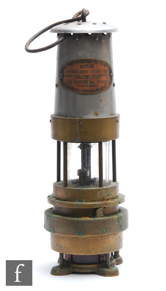A brass miner's lamp with aluminium chimney and plaque named Naylor Spiralarm type ?M?, by L H