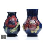 Two Moorcroft vases of varying form, the first decorated in the Anemone pattern, the second in the