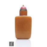 A 19th Century Chinese honey agate snuff bottle, of rounded rectangular form with high cylindrical