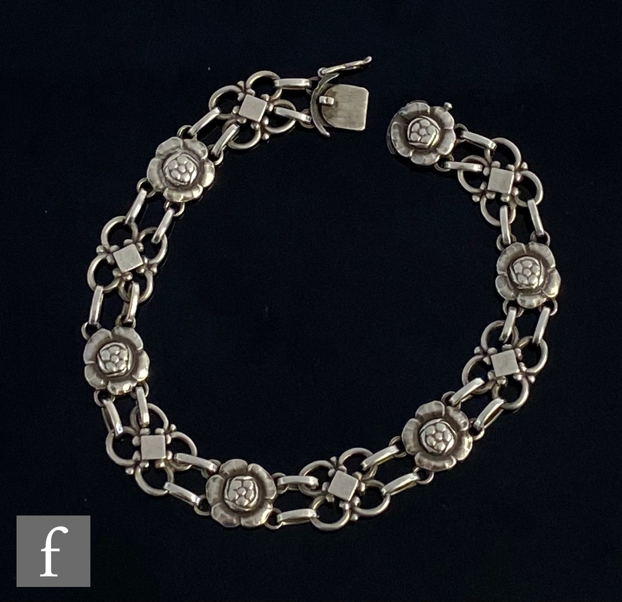 A Danish silver foliate bracelet designed as alternating quatrefoil links between blossoming