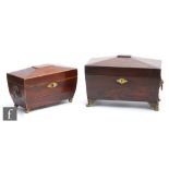 A 19th Century inlaid mahogany sarcophagul tea caddy with associated glass liner and key, on brass