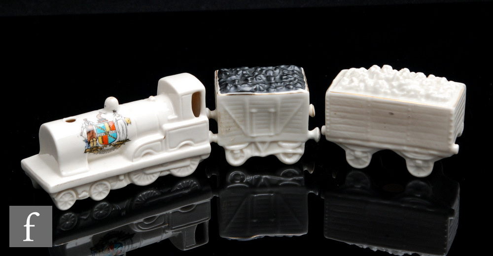 An early 20th Century crested china model of a train with coal wagon together with 'A Truck of