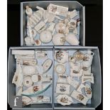 A large collection of assorted early 20th Century crested china of varying form and subject to