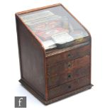 A 1920s or later wooden display cabinet by Patchquick Patent Specialities, the domed glazed top over